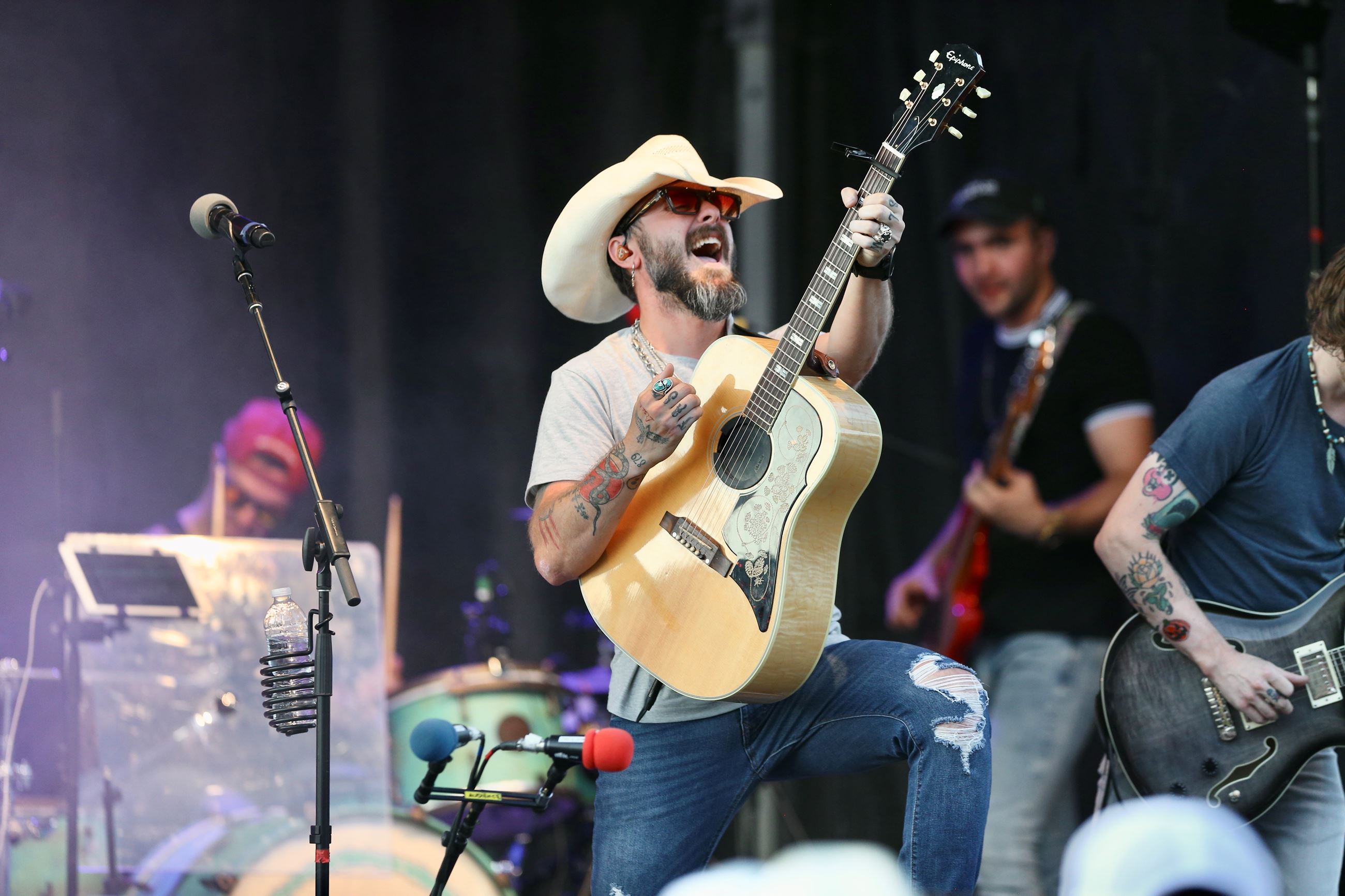 Man Singing and Playing Guitar