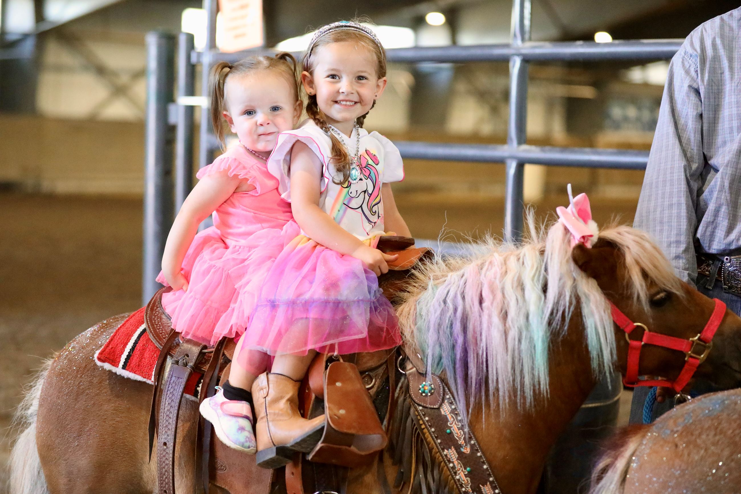 Two Little Girls Ride a Pony